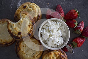 Open pies with cottage cheese close up.Â  Traditional Russian bakery. Freshly baked pastry items top view photo.Â Â 